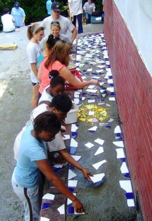 COL students work on a volunteer project for a program benefiting at-risk adolescents.